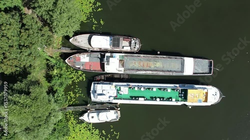Berlin Spandau Aerial view of a riverside promenade with small boats docked along the edge