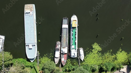 Berlin Spandau Aerial view of a riverside promenade with small boats docked along the edge
