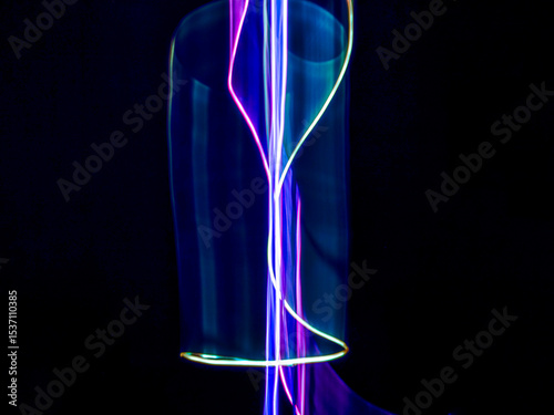colorful light trails in dark background. Abstract light routes that rotate in vibrant colors. Forestry of the blurry movement of light painting. Blurred lights at night. Intentional camera movement,	