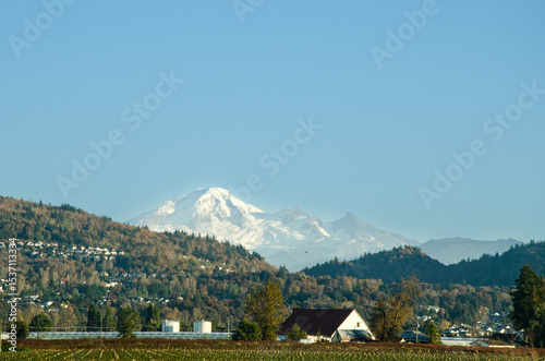 View of Fraser Valley countryside around Chilliwack, BC, Canada. Snow covere d peaks of Mt. Baker visible in the background