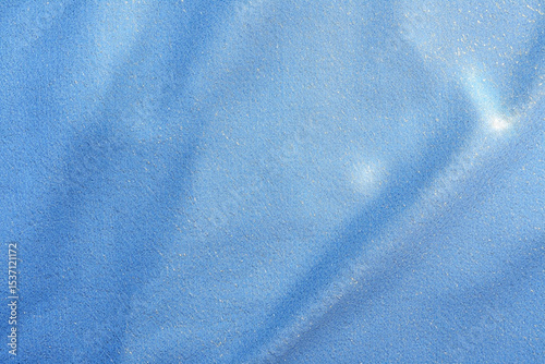 Light Blue Glitter Fabric Texture Subtle Shadow Detail Close Up Shot Sparkling Surface Shimmering Background