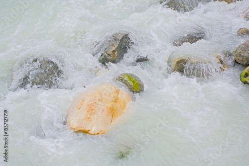 Rocks in streaming water of a mountain river. 