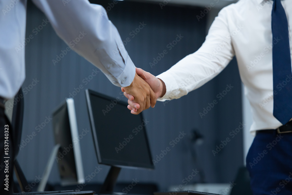 Fototapeta premium businessman shaking hands on business cooperation agreement. Successful Asian businessmen handshaking after good deal. successful negotiate, hand shake celebration partnership and business deal