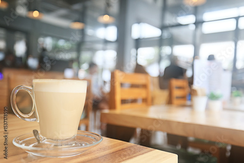 cappuccino, coffee in a clear glass cup in a cafe, soft color background food and drink, hot drink
