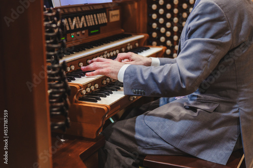 Фотография Man playing a church organ