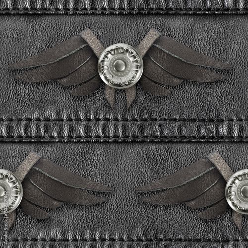 Seamless 4k photo texture material of black leather strap surface with cutout wings decoration.