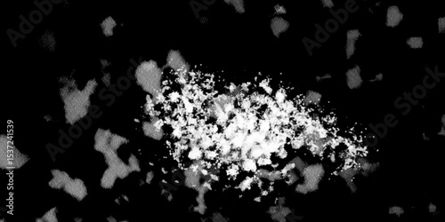Snowflakes on dark background. white icy snowflakes isolated on black background, natural background. white crystalline powder on a black background. sugar dust. texture, pattern and clipping.