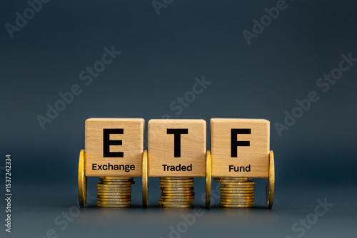 Wallpaper Mural Symbol ETF, Exchange Traded Fund, Business and financial concept. Wooden cubes with an ETF icon on a navy blue background. A stock market index fund in the financial sector for business stocks. Torontodigital.ca