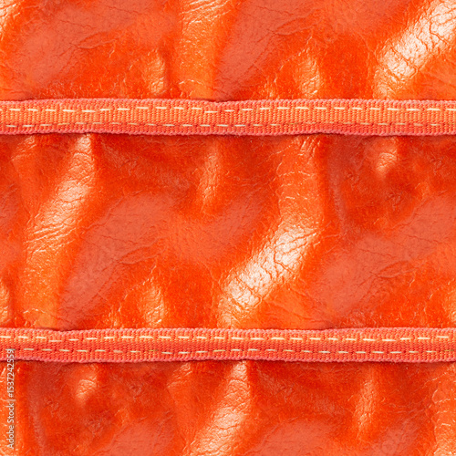 Seamless 4k photo texture material of orange colored creased leather surface with stitching.