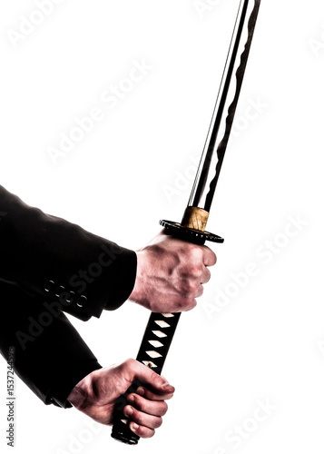 A person holding a samurai sword.