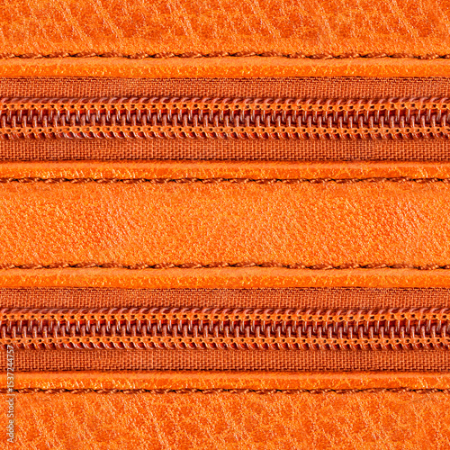 Seamless 4k photo texture material of orange toned leather surface with plastic zippers.