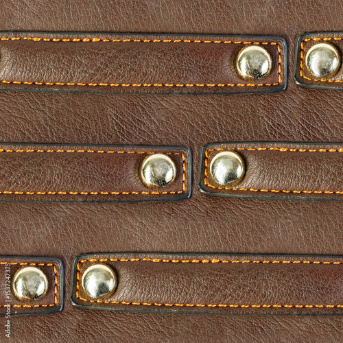 Seamless 4k photo texture material of brown leather surface with riveted straps.