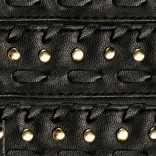 Seamless 4k photo texture material of black leather straps with braiding and metal rivets.