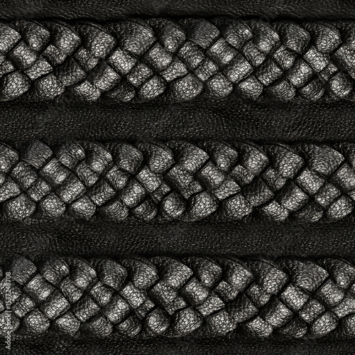 Seamless 4k photo texture material of black leather surface with leather braided ropes.