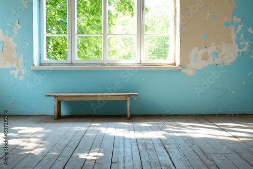 Empty room with light blue walls wooden bench and natural sunlight through a window