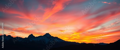 Majestic mountain range silhouetted against a vibrant, colorful sunset sky , awesome, spectacular