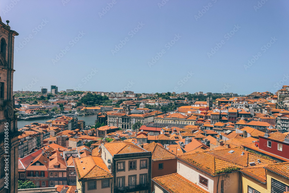 Fototapeta premium panoramic view of orange roofs with colorful houses in the city of porto portugal