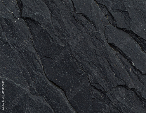 Close-up of a dark slate surface with a textured, cracked pattern