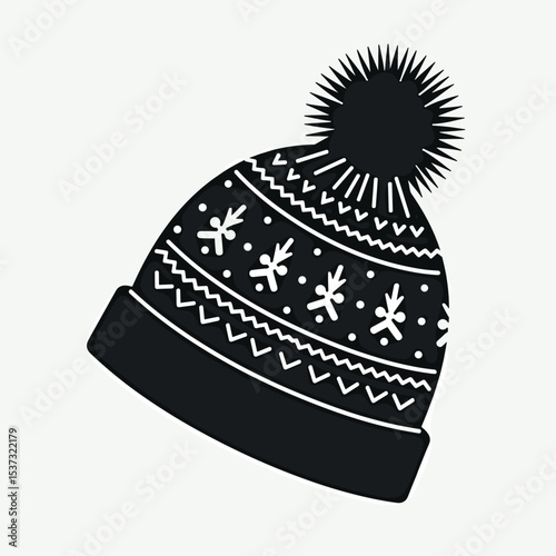 Warm knit winter hat with pompom and snowflake design  