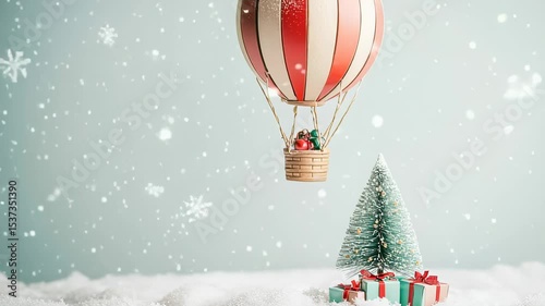Festive winter scene with hot air balloon, Christmas tree and gifts in falling snow
