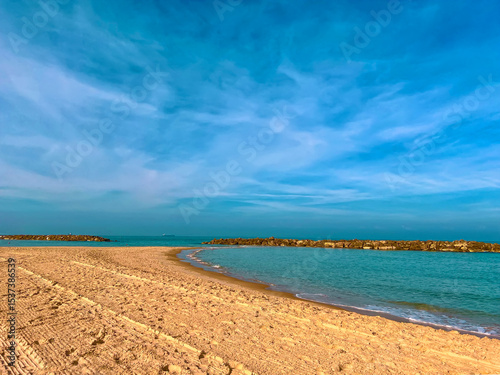 Sandy beach with beautiful clean sea. Warm Mediterranean sea with light waves. Paradise place for relaxation, vacation, tourism. Lonely sandy beach with beautiful waves. Beach of Israel, Ashkelon.