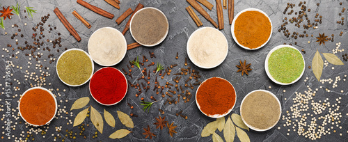 a set of different spices in bowls: