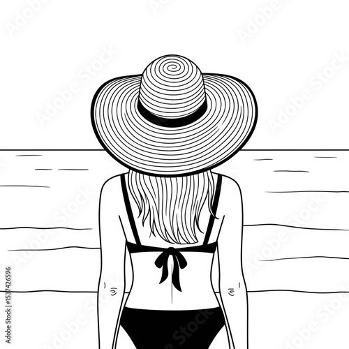 Woman feeling relaxed, looking at the ocean in a stylish hat at the beach