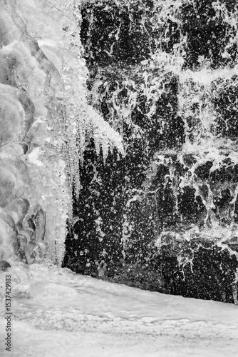 Water and ice at a small dam in central Connecticut.
