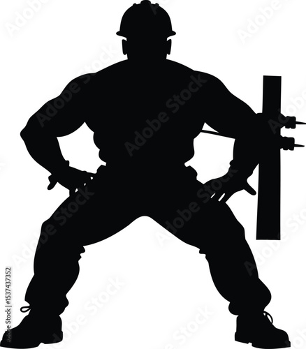 Silhouette of a muscular lineman holding a power pole steady with his body