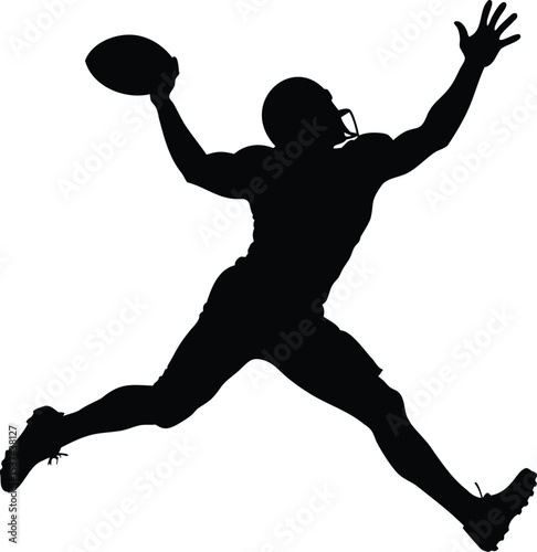 Silhouette of an American football player catching a pass midair with grace