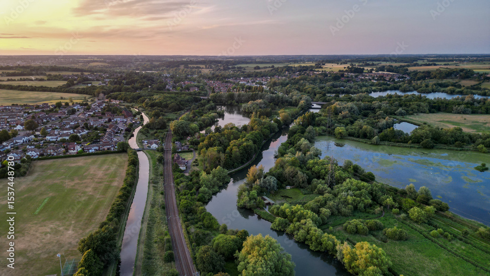Fototapeta premium Aerial view of Hoddesdon, Hertfordshire showing river, sunset and housing estate