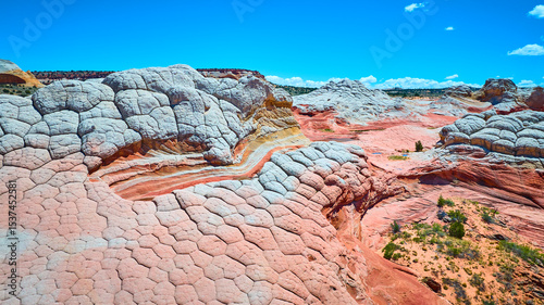 Fotografía Aerial Over White Pocket Sandstone Swirls and Polygonal Rock Formations Arizona