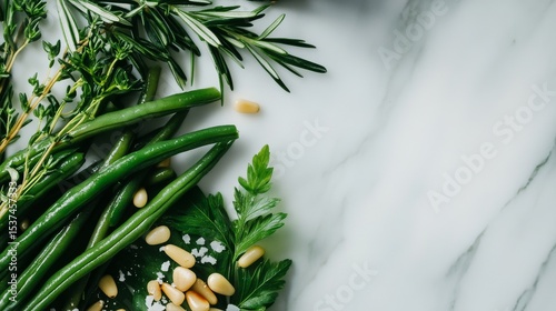 Fresh Herbs and Green Beans Arranged on Marble Countertop With Pine Nuts and ...