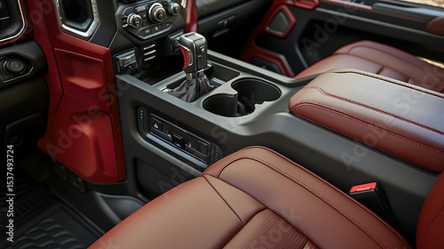 Interior of a modern truck with a gear shift lever and red leather seats