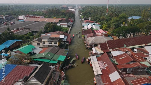 Longtail boats sailing on canals of Damnoen Saduak Floating Market, Aerial View, Thailand, Bangkok.