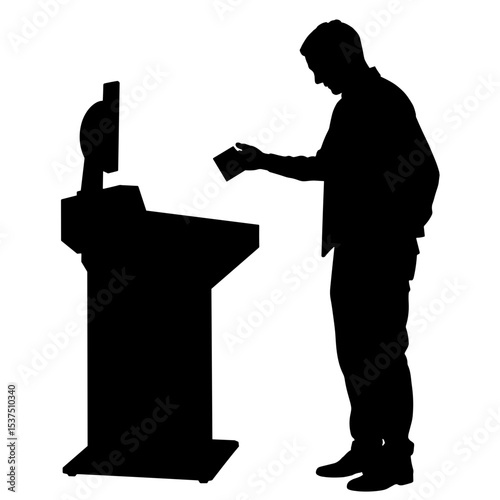 Silhouette of person scanning ticket at kiosk, self-service technology