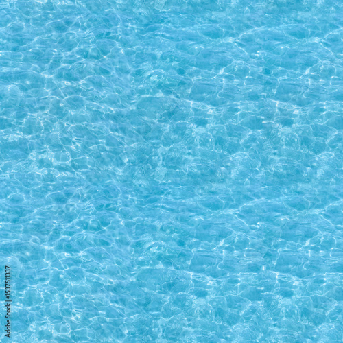 Water ripple seamless background texture - top view of clean, clear, blue water ripples. Image can be tiled to create a larger image or higher resolution background. Water has the chemical formula H2O