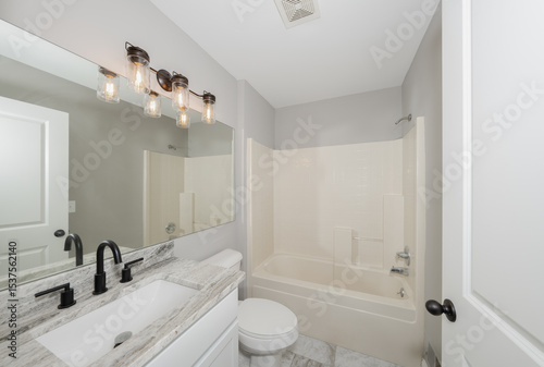 bathroom has been updated with a new vanity new tile and new fixtures installed by a professional