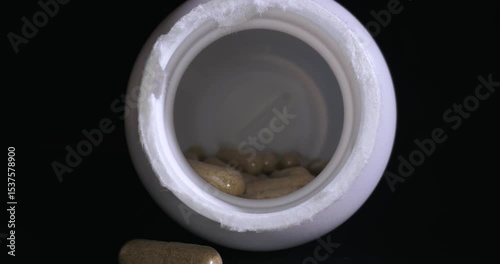 Drug pills spinning in a bottle