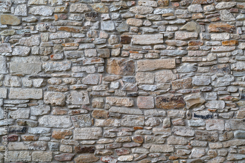 Detail of a traditional dry stone masonry. Old castle wall. Stone wall