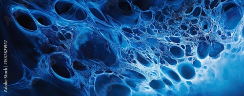 A close-up of intricate ice patterns on the surface, captured in a cool blue tone 
