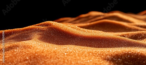 A close-up of the sand texture on an orange desert dune, captured in high resolution 