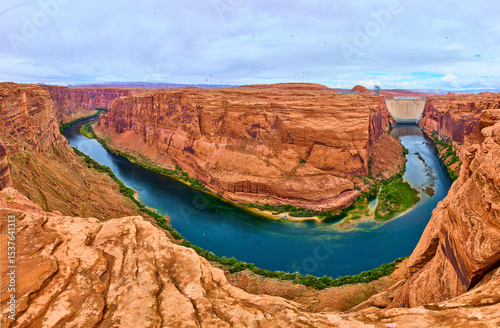 Glen Canyon Dam and Colorado River Winding Through Red Sandstone Aerial Panorama