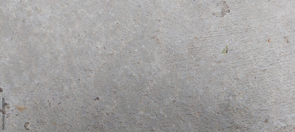 Superficie de concreto con una textura uniforme, su color es gris claro, sin elementos adicionales visibles. Superficie de concreto con una textura uniforme, su color es gris claro, sin elementos adicionales visibles.