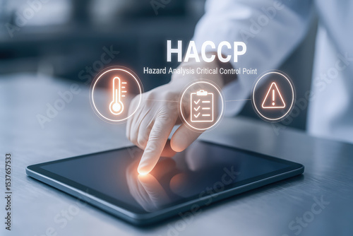HACCP hazard analysis critical control point concept with hand touching digital tablet for food safety and quality management system in industry