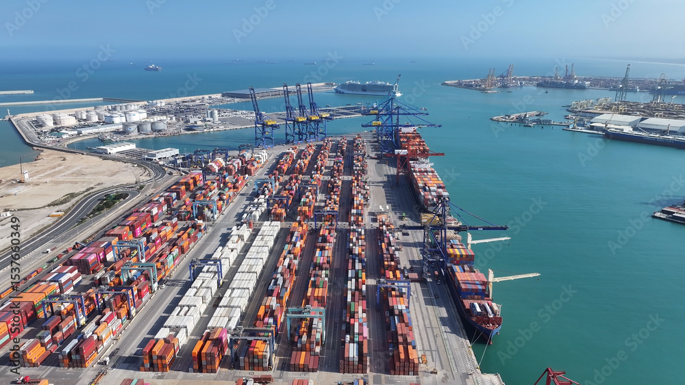 Obraz premium Port Of Valencia At Valencia In Valence Community Spain. Freight Ship Scene. Maritime Transportation. Port Of Valencia At Spain. Exchange Landscape. Trade Market Scenery.