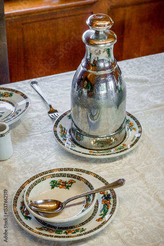 Antique place setting in luxury mid century rail dining car