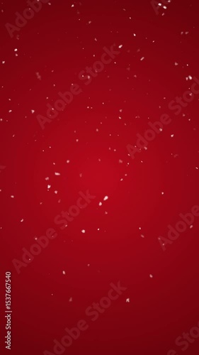Snowflakes falling on red background. Digital Animation. Vertical footage