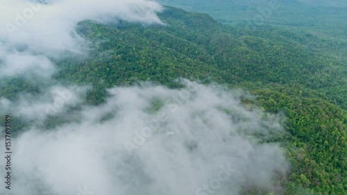4K hyperlapse video. A beautiful aerial view of the valley landscape in the morning. Filled with morning mist, Mae Mo District, Lampang Province, Thailand.