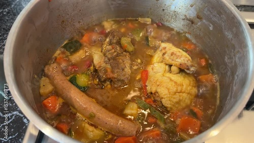 Traditional Moroccan or North African couscous stew simmering in a pot